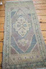 Oushak rug close-up: calming center medallion with nuanced drawing, abrash, and soft palette.