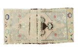 Vintage Oushak rug mat featuring playful abrash, central coffee brown motif, and soft pastel tones.