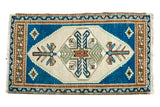 Vintage Oushak rug mat with tribal geometric plant motifs in beige, aqua blue, and bronze.