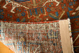 Hand-knotted reverse and secure side of vintage Karaja with brick red gul motifs.