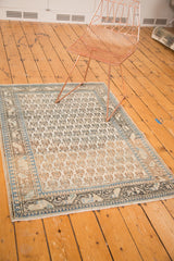 Vintage Mir Sarouk rug corner, ivory field, geometric sky blue and charcoal borders.