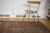 Vintage Shiraz rug's double medallion and rams horn design in chestnut, slate blue, and ivory.