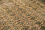 Blanched pink ivory distressed vintage Pakistan carpet with geometric Turkmen design.