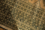 Distressed vintage Turkmen geometric design with dark green and blanched ivory hues.
