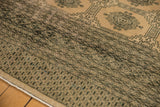 Distressed geometric Turkmen pattern with blanched pink ivory tones.