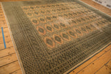 Vintage Pakistan carpet with blanched pink ivory Turkmen field and geometric border.