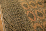 Blanched pink ivory distressed carpet, featuring Turkmen gul motifs and geometric patterns.