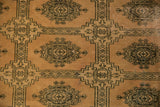 Blanched pink ivory distressed pile of a vintage Pakistan carpet with dark geometric Turkmen design.