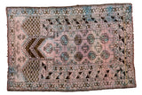 Distressed vintage Dualatabad rug in dusty blush, blue, and charcoal prayer mehrab design.