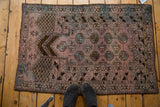 Distressed dusty blush Dualatabad rug with uni-directional mehrab and Bokhara gul motif.