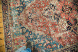 Textured distressed Persian Heriz rug, brilliant cherry red and sapphire blue pattern.