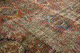 Distressed vintage Karaja carpet pile, geometric medallions in rich brick red and aqua.