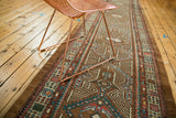 Traditional geometric Serab runner with repeating camel hair medallions and blue mehrab niches.