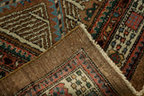 Secure edge and natural undyed camel hair foundation on a vintage Serab rug.