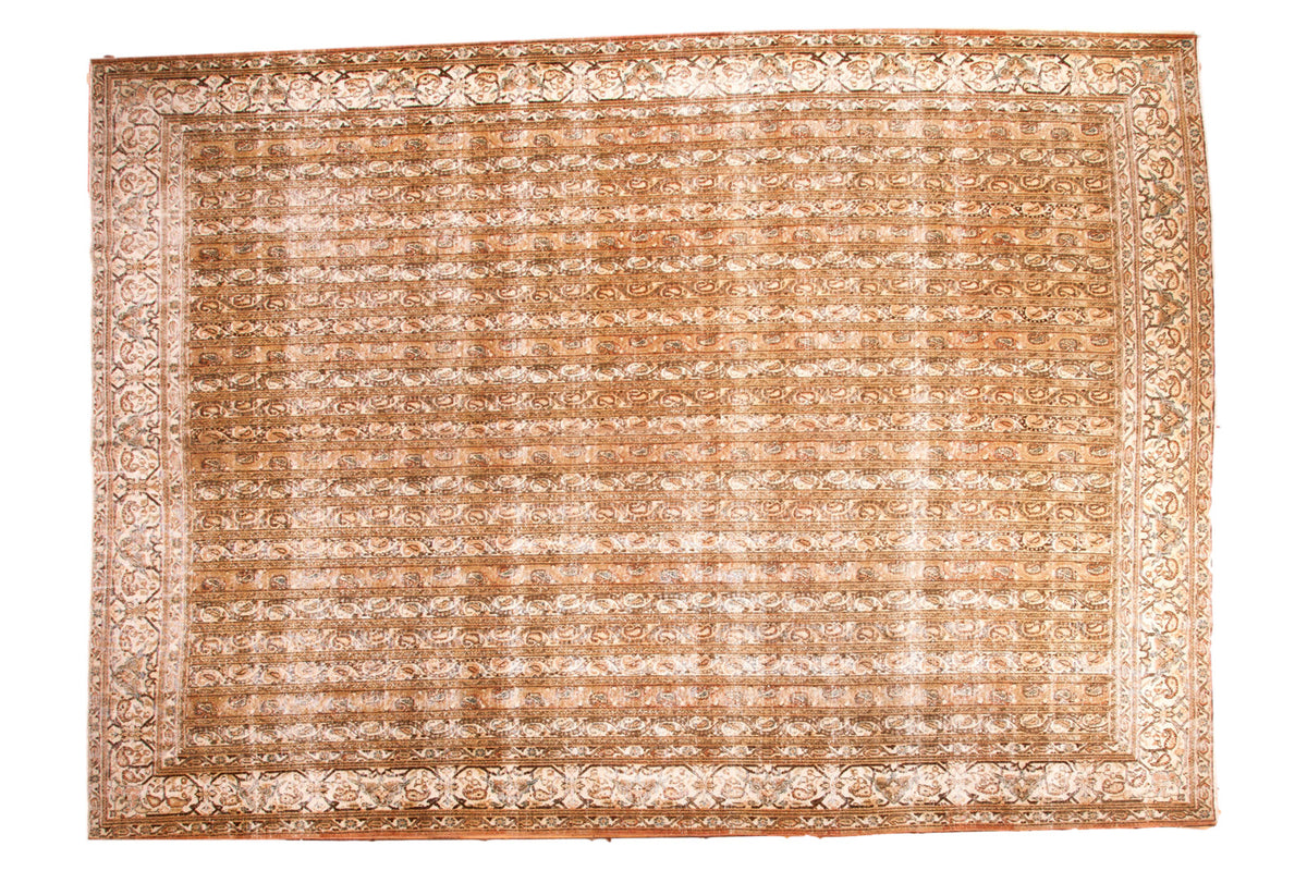Distressed Vintage Qom carpet, allover water channels, vines, botehs, in muted earthy tones.