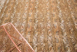 Distressed vintage Qom carpet pattern with muted ivory, green, and blush botehs.
