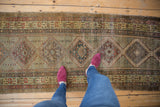 Repeating geometric medallions and intricate borders on a vintage Serab runner.