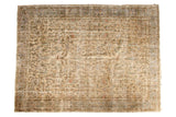 Distressed vintage Oushak carpet, an allover floral pattern in muted beige, blue, terracotta.