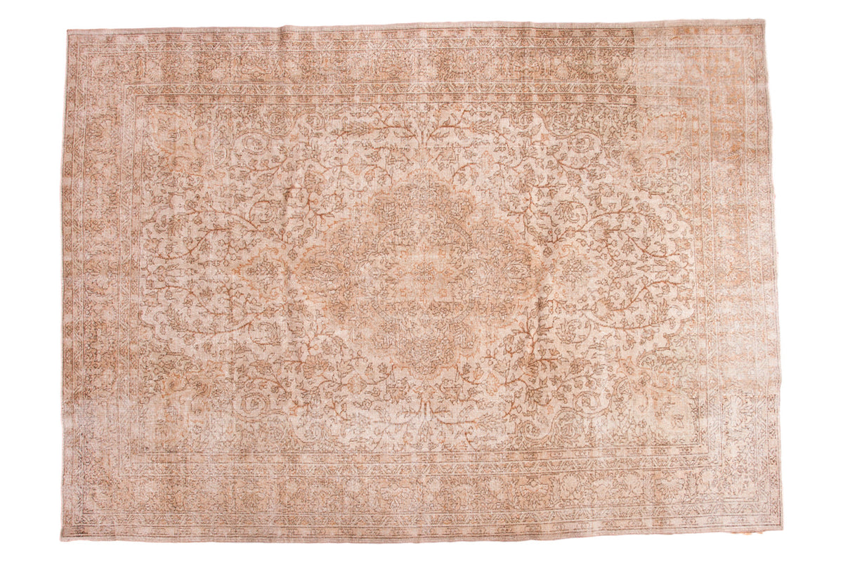 Distressed Vintage Oushak carpet with cream, faded peach, charcoal floral medallion, 8x11 feet.