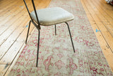 Textured distressed vintage Oushak runner with faded ivory and raspberry red motifs.