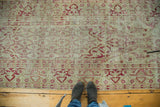 Artfully distressed vintage Oushak runner with faded raspberry red and ivory lattice pearl motifs.