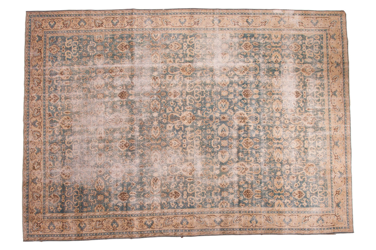 Distressed vintage Oushak carpet with faded sea blue and khaki allover floral pattern.