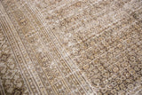 Textured distressed vintage Khorassan rug, faded allover pattern in cream, charcoal, and silver.