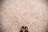 Distressed vintage Oushak rug pile with soft cream, ballerina pink, and lavender tones.