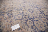 Worn character and texture of a vintage Turkish Oushak rug in beige and violet.