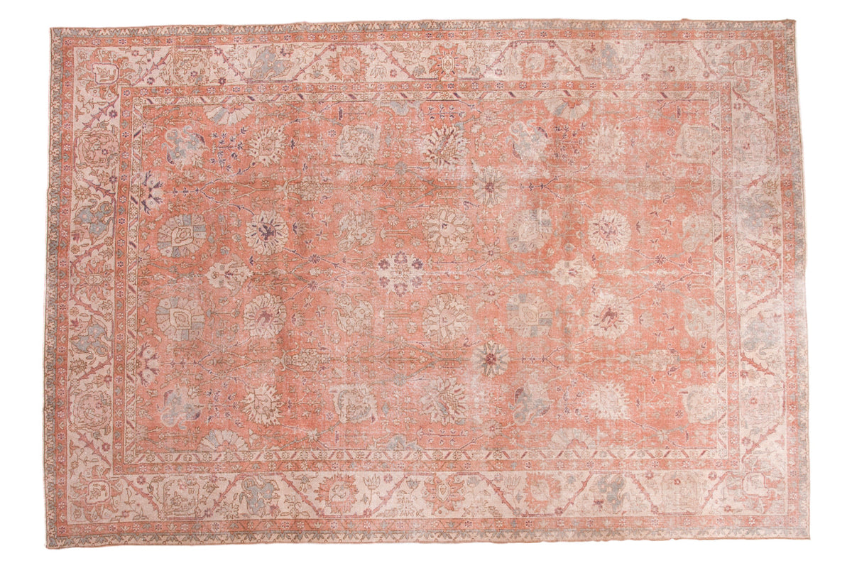 Vintage distressed Oushak carpet with faded crevette pink, ivory, seaglass blue floral design.