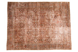 Distressed vintage Mahal carpet with an allover pattern of terra-cotta, cream, and blue-gray.