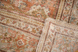 Textured pile and hand-knotted reverse of distressed Mahal rug in rose gold and cream.