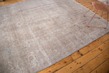 Aged texture of a distressed Turkish Sivas carpet, with light blue and platinum tones.