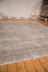 Vintage Sivas carpet displaying overall even distress, subtle blue, ivory, and platinum tones.
