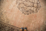 Distressed Oushak carpet with worn rose-brown pile and slate silver border patterns.