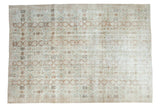 Distressed Vintage Oushak carpet, allover floral palmettes in muted blues, teal, and wooded tones.