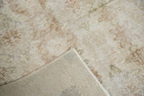 Distressed floral palmettes and hand knotted reverse side of a vintage Oushak rug.