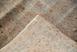 Soft, distressed beige and aqua pile texture, showing hand-knotted Kashan foundation.