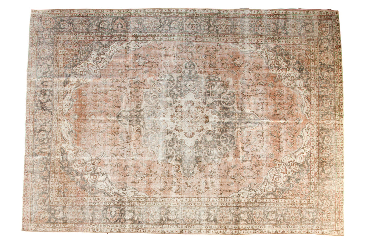 Distressed vintage Oushak carpet, ornate medallion with pale blush, silver, grey, ivory tones.