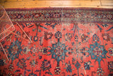 Distressed Persian Mahal rug detail with watermelon red field, teal palmettes, border.