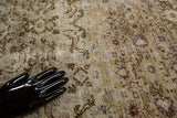 Textured distressed Oushak carpet pile with intricate faded vinery and floral patterns.