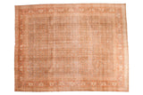 Distressed vintage hand knotted Persian Tabriz rug with subdued brown and faded rust, 9'8