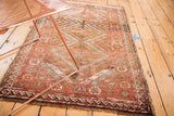 Vintage Kurd rug detail showing pomegranate main border and geometric field in rust tones.