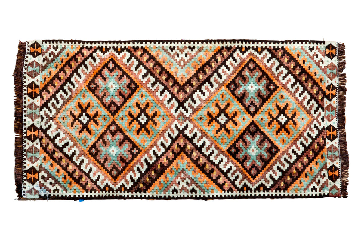 Vintage hand-knotted Kilim rug with intricate diamond medallions, tangerine, teal, charcoal, ivory.
