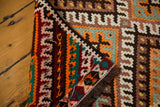Vintage Turkish Kilim rug corner, displaying vibrant geometric flatweave and secure edge detail.