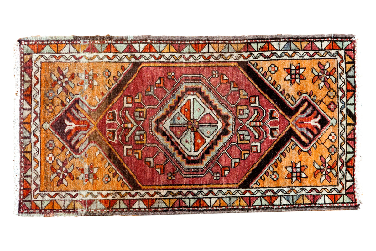 Vintage Oushak rug mat with cinnamon red medallion, tangerine orange field, and geometric floral spandrels.