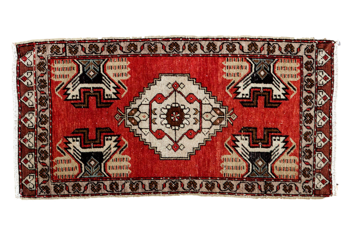 Hand knotted Vintage Oushak rug, cherry red field, ivory medallion, charcoal plant motifs.