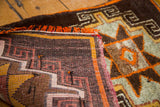 Hand knotted Oushak rug mat: secure edge, orange fringe, and tribal geometric pattern.