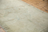 Subtle ivory and sea foam green oversized medallion and floral pattern on vintage Oushak pile.