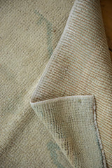 Hand-knotted Vintage Oushak runner, detail of ivory pile, sea foam green hints, and woven foundation.